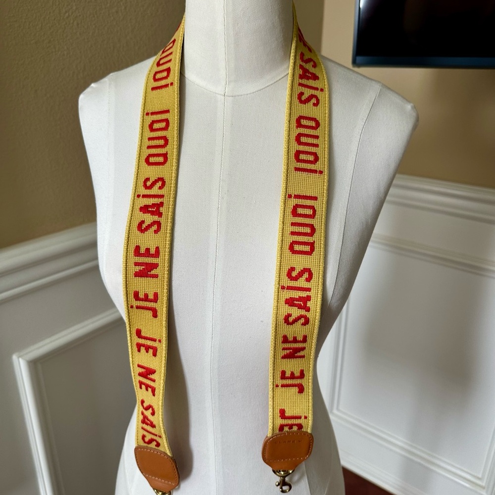 Je Ne Sais Quoi Yellow Strap with Red Text